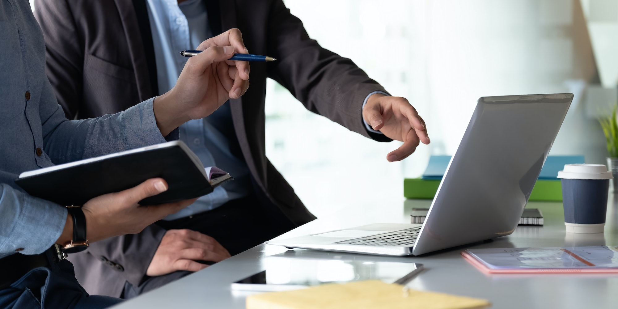 Group of Businesswoman and Accountant checking data document on laptop computer for investigation of